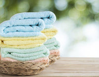 Clean folded laundry that has been washed with all natural non-toxic laundry detergent